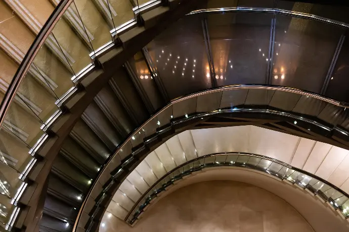 Round stairs with glass railing A round stairway
