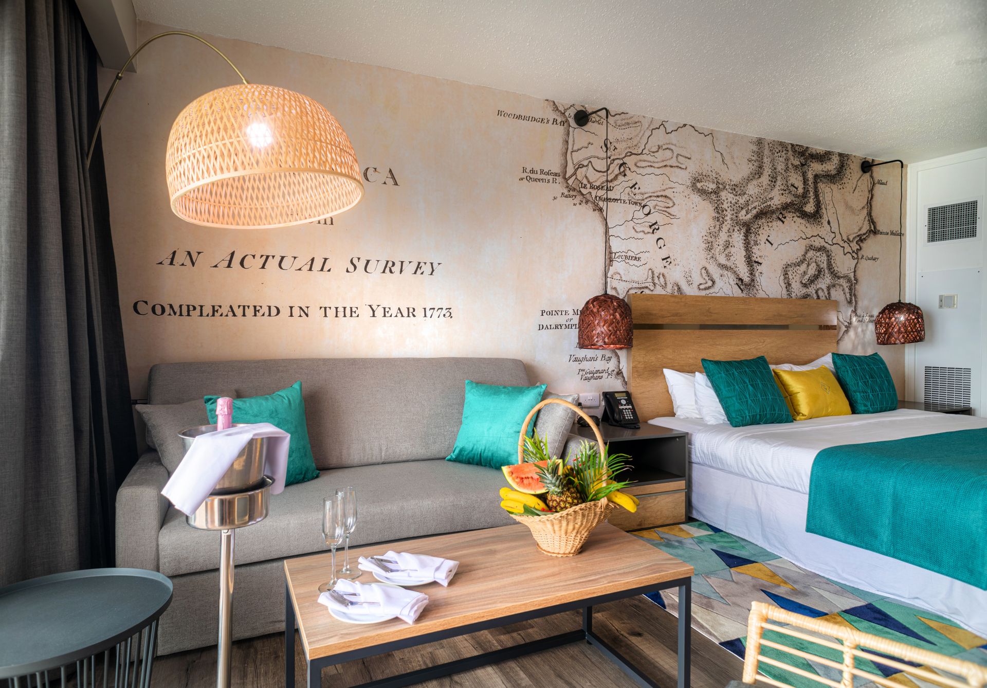 Description:Hotel room featuring a bed, couch, and a stunning wall mural.