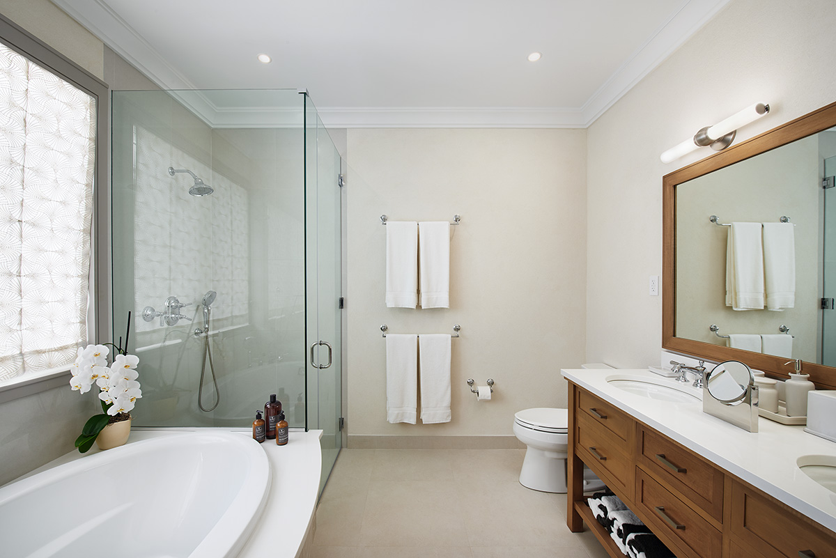 Modern bathroom featuring large shower and sink.