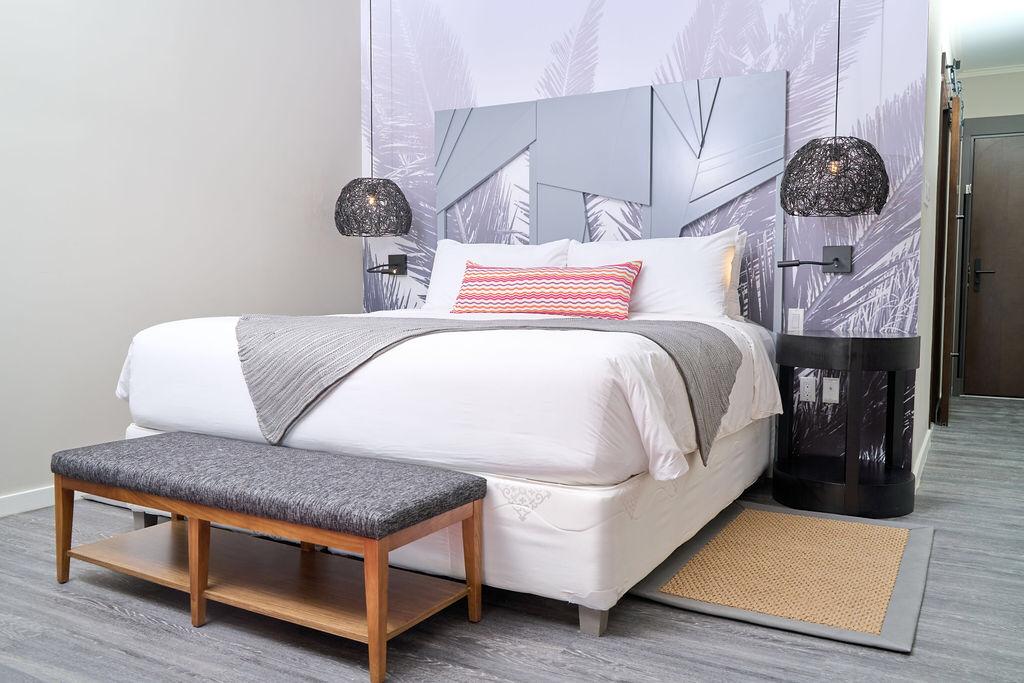 Bedroom at Hotel La Casa with cozy beds and modern decor.