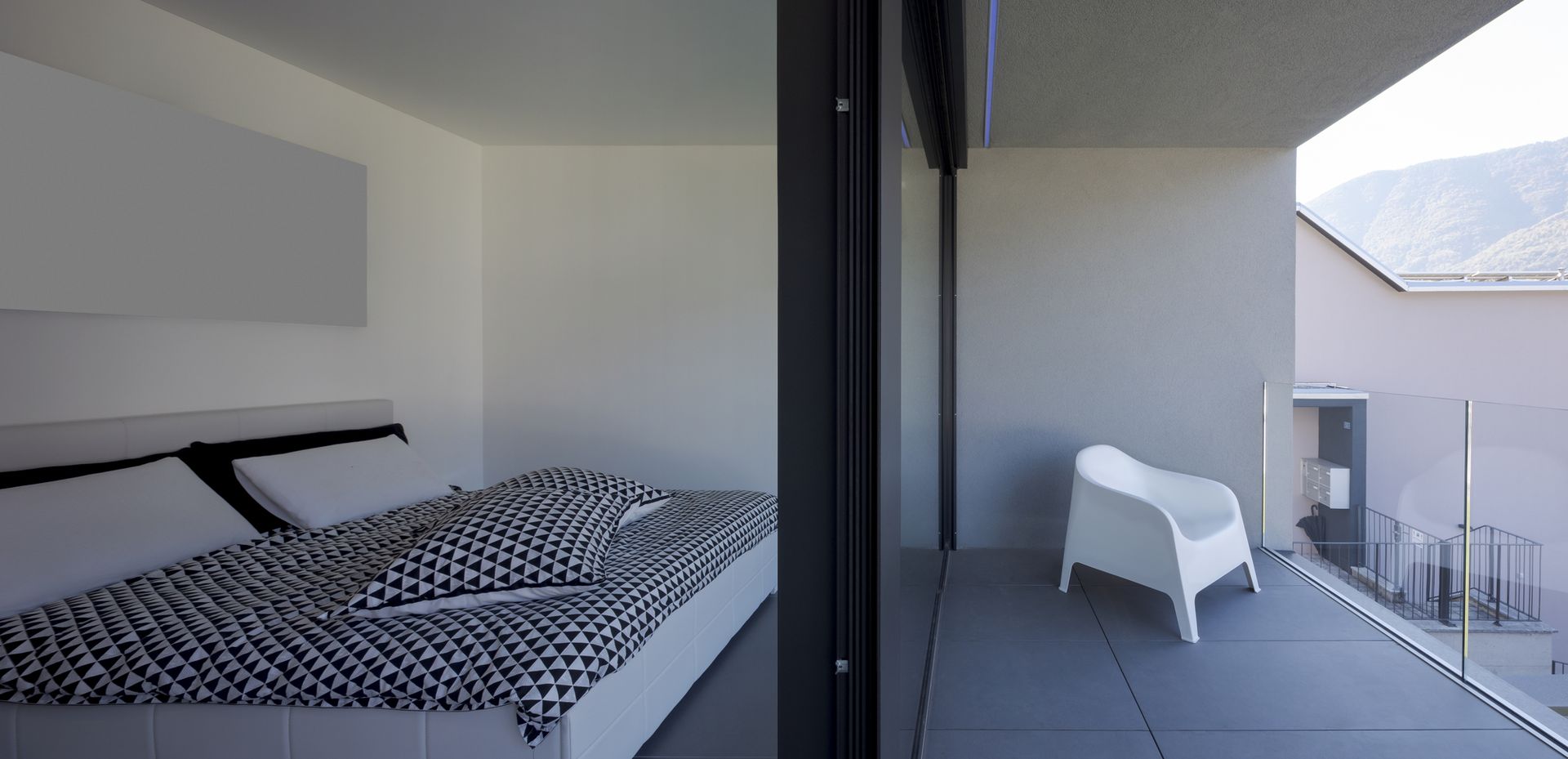 Bedroom with scenic mountain balcony