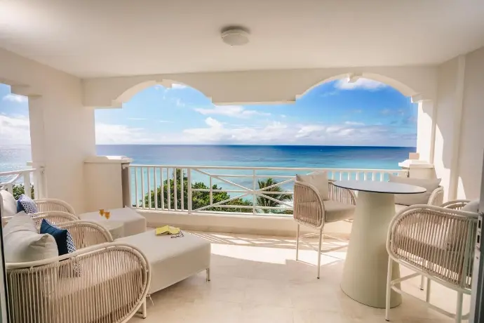 A serene hotel balcony with stylish chairs A charming balcony adorned with comfortable chairs