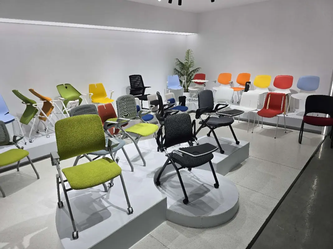 A showroom featuring a variety of office chairs A large display of office chairs in a showroom